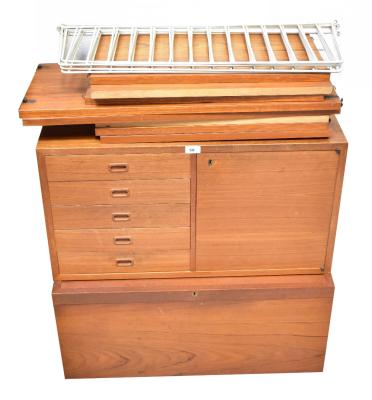 STRING; teak wall hanging shelf system comprising six white 'ladders' and eight shelves, in two different lengths, plus two teak units comprising one with fall font and one String unit with cupboard beside five drawers.