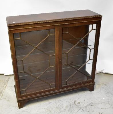 A reproduction mahogany display cabinet, the moulded top above a pair of astragal glazed doors, raised on bracket feet, 112 x 108 x 32cm.