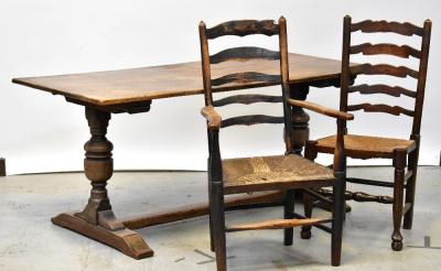 A 19th century ash and elm hoop back Windsor arm chair of small proportions, raised on turned stretchered supports.