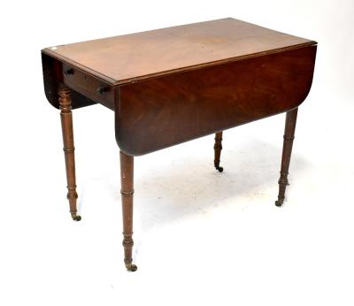 A George III mahogany Pembroke table with faux frieze drawers, on tapering ring turned legs to castors, 72 x 91 x 49cm (when closed).