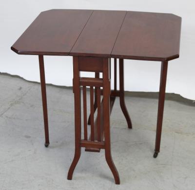 A mid-20th century mahogany drop-leaf tea/trolley table on curved tapering supports and castors, length when extended 72cm.