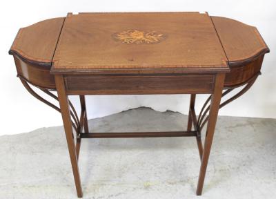 A mahogany early-to-mid 20th century mahogany inlaid side table with central vignette of floral and wheatsheaf inlay, two compartments to either side with lift-up tops to velvet-lined interior, to tapering supports and cross-stretcher with outswept decoration to either side, 75 x 96cm.