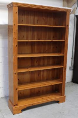 A large modern pine open bookcase with adjustable shelves, flanked by fluted pilaster columns, height 201cm.