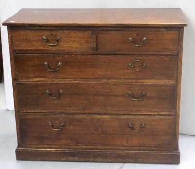 An Edward VII oak chest of two-over-three graduated drawers on plinth base, height 92cm.