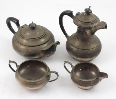 An Elizabeth II hallmarked silver four-piece tea service, Walker & Hall, Sheffield 1962, comprising teapot, hot water jug, sugar bowl and milk jug, approx 47ozt.