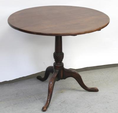 A late 19th/early 20th century mahogany circular table on column support and tripartite base, diameter 82cm.