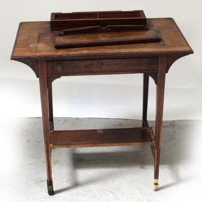 An Edwardian rosewood bonheur du jour with elevated stationery compartment and writing surface (lacking leather), surmounting a single frieze drawer on square tapering legs united by a shelf stretcher, height approx 83cm (af).