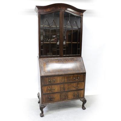 An early/mid-20th century walnut elevated bureau bookcase with arched top and astragal glazed doors surmounting a stationery well and three-drawer base supported on carved ball and claw feet with gadrooned apron, height approx 210cm.