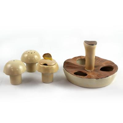 A Carlton Ware English stamp mushroom cruet, salt, pepper and mustard modelled as mushrooms in an upturned mushroom tray, height 9cm.