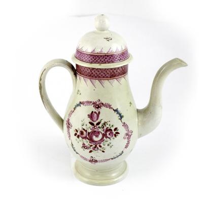A late 18th century Liverpool creamware coffee pot with pink floral diaper pattern banding and floral reserves decorated with rosebuds, height 22.5cm.