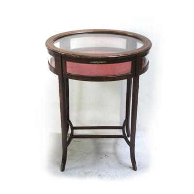 An Edwardian mahogany inlaid bijouterie, oval glass top and glass panels to the sides, on tapering splayed supports and cross-stretcher, height 77cm, width 58cm.