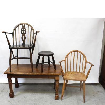 A vintage oak rectangular coffee table on turned support and block feet, length 100cm, a small circular oak stool, splayed turned supports to cross-stretchers and two country-style stick-back carvers (4).