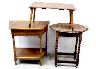 A 1950s walnut lounge table on turned tapering supports, an oak hall table with canted corners and an oak oval occasional table on barleytwist supports to shepherd's castors (3).