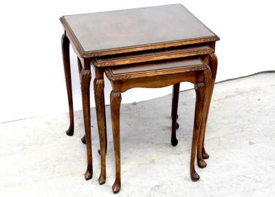 A nest of three mid/late 20th century walnut and stained beech occasional tables on cabriole legs, width of largest 53cm.