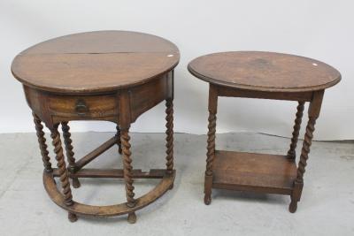 A c1930 oak demi-lune dropleaf side table on barleytwist supports, width 75.5cm and a small oak oval occasional table on barleytwist supports united by a shelf-stretcher (2).