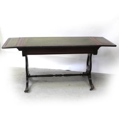 A 20th century mahogany reproduction sofa table with tooled green leather insets, width 89cm.
