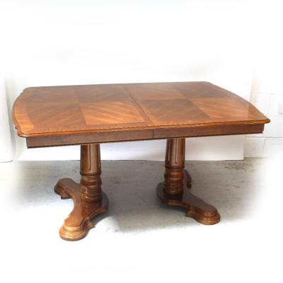 A mid/late 20th century French-style oak draw-leaf table on twin pedestal base, length 152cm.