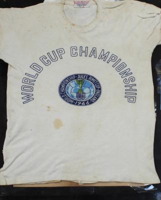 A souvenir 1966 World Championship Jules Rimet Cup - England World Cup Champions T-shirt, size medium, in later mahogany frame.