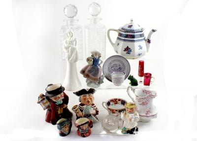 A mixed lot of ceramics and glass to include a Lladró figure of a girl in bonnet with basket of flowers, a Royal Worcester blanc de Chine figure group from the 'Moments' range of figures, entitled 'Tender Love', Wedgwood & Co Toby jugs, cut glass decanters, a Mary Gregory style posy vase etc.