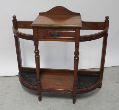 A Victorian Aesthetics walnut hall stand, the table top and single frieze drawer flanked on either side by stick stand hoops and drip trays, height 88cm.