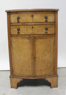An Edward VII walnut bow-front cabinet with two frieze drawers over twin-cupboard base, on square bracket feet, height 95.5cm.