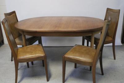 A G-plan 1960s teak dining table, width 112.5cm and four G-Plan teak chairs, each with upholstered back and seat in faux brown leather (5).
