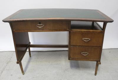 A late 1950s/early 1960s teak desk with tooled green leather over a single frieze drawer and filing compartment surmounting a two-drawer single pedestal base, width 106cm.