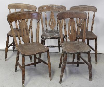 A Victorian pine kitchen table to turned supports and castors, 128 x 87cm and five country-style pine kitchen chairs, some in need of restoration (6).