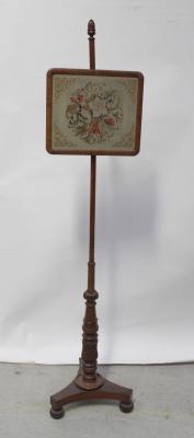 A 19th century mahogany pole screen, floral tapestry screen to spreading column base with acanthus decoration to tripartite support, length 143cm.