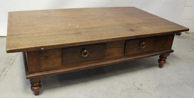 A large contemporary hardwood coffee table, two small drawers to either side to turned baluster supports, length 122cm.