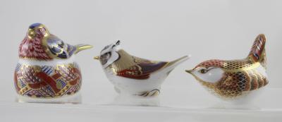 Three Royal Crown Derby paperweights, a Collectors' Guild 'Crested Tit' with gold stopper, 'Derby Wren' with silver stopper and 'Chaffinch Nesting' with silver stopper, all boxed (3).