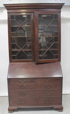 A Georgian mahogany bureau, the fall front enclosing fitted compartments and drawers above two short and three long drawers, raised on bracket feet and a later mahogany bookcase top section with two astragal glazed doors (af) (2).