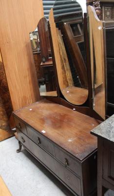 A mid-20th century triple mirror back dressing table, three frieze drawers over one lower drawer, to outswept cabriole supports and a matching tallboy (2).