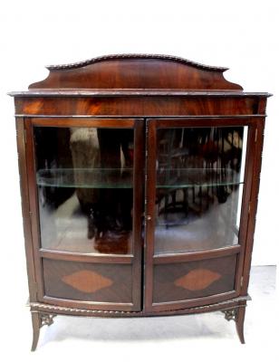 An early 20th century mahogany bow-fronted display cabinet with pair of glazed cupboard doors, on outswept legs, height 137cm, width 107cm.